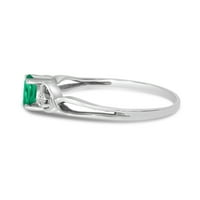 Ovalni prsten od bijelog zlata od 14 karata sa smaragdom i dijamantom